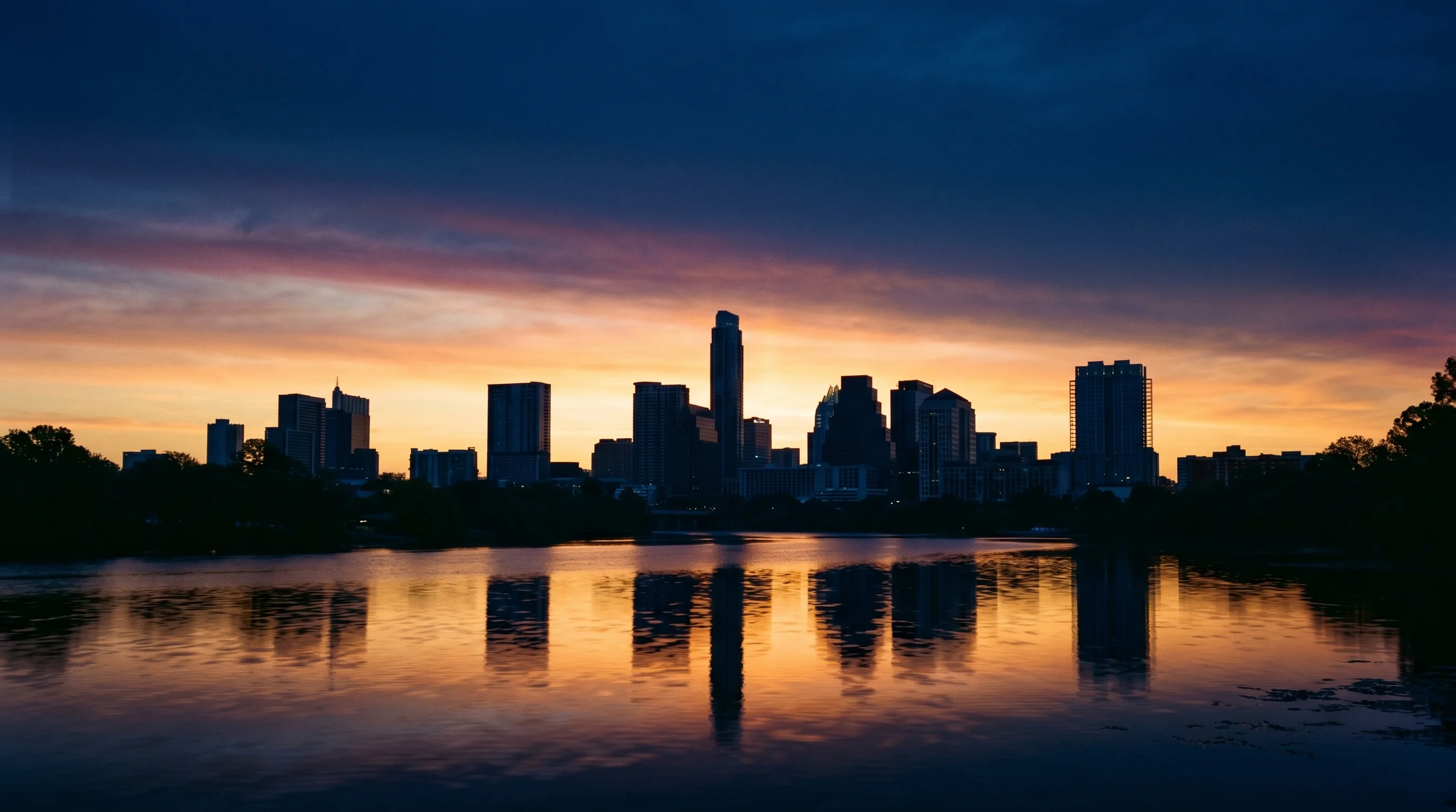 Abstract Austin Texas skyline silhouette at sunrise with warm amber tones